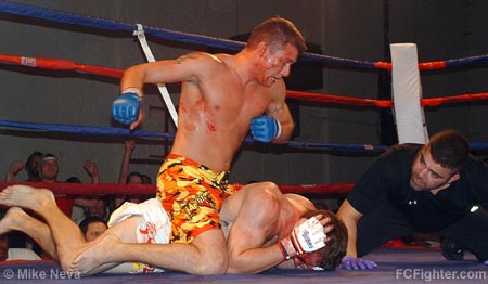 Ax Fighting 12: Buck Bisbey pounding on Jesse McCarty - Photo by Mike Neva