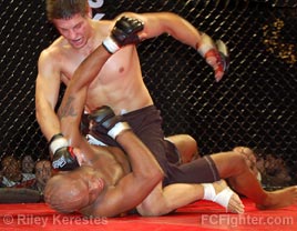 Cage Fighting Championships Underground: Tommy Lee raining down punches on Norm Alexander - Photo by Riley Kerestes