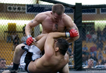 Combat in the Cage 3: Dante Rivera pounding his way to a TKO victory over Eric Tavares - Photo by Tom DeFazio