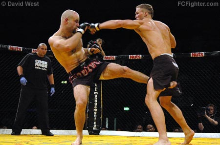 Cage Rage 18: James Evans-Nicolle (left) kicks as Zelg Galesic punches - Photo by David West