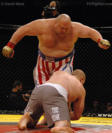Cage Rage 19: Rob Broughton (foreground) goes low on Eric 'Butterbean' Esch for a takedown - Photo by David West