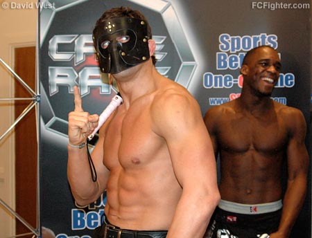 Cage Rage 19: Alex Reid posing in his bondage outfit as opponent Xavier Foupa-Pokam laughs in the background - Photo by David West