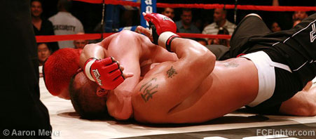 Icon Sport 48: Jason Miller forces Robbie Lawler to tap out to a head and arm choke - Photo by Aaron Meyer