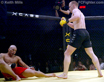 Kampmann standing with Seguin on the floor out cold