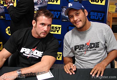 Phil Baroni and Dan Henderson signing autographs