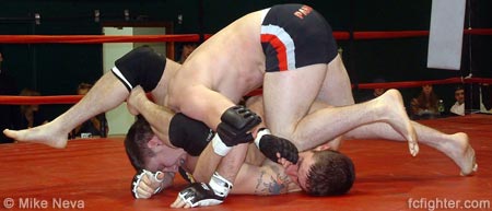 Matt Lininger fighting off a triangle with a knee to the face