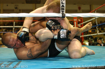 Gabert punches as Rodriguez cranks his arm