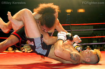 Total Fight Challenge 10: Dan Hornbuckle finshing off Alex Carter with a triangle choke - Photo by Riley Kerestes
