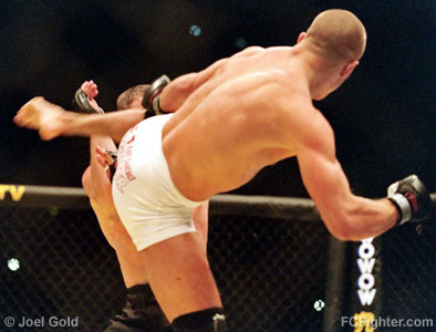 UFC 50: Georges St. Pierre looking to land a kick on Matt Hughes - Photo by Joel Gold
