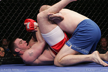 Ultime Warrior Challenge: Toby Johnson locking up a triangle choke on Eric Hill - Photo by Keith Mills