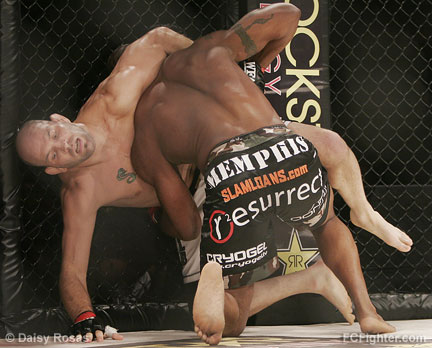 Matt 'The Law' Lindland gets picked up by Quinton 'Rampage' Jackson - Photo by Daisy Rosas