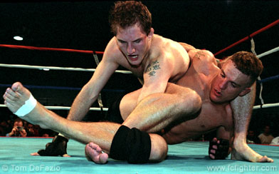 Pete Sell with a shoulder lock on Ted Govola
